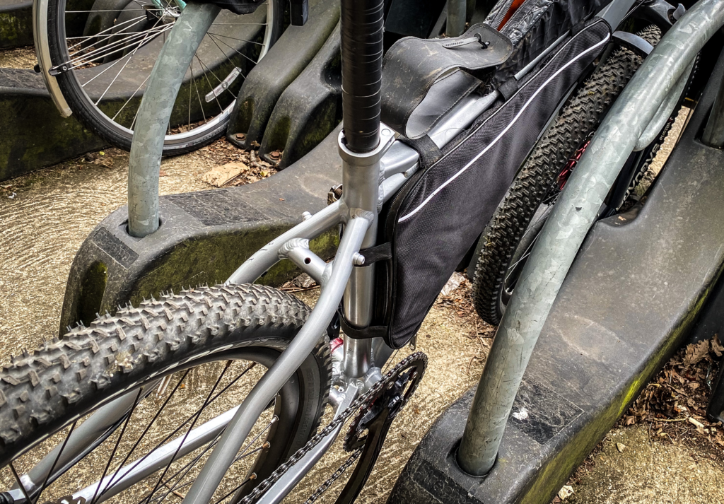 Photo of a mountain bike parked at a bike rack